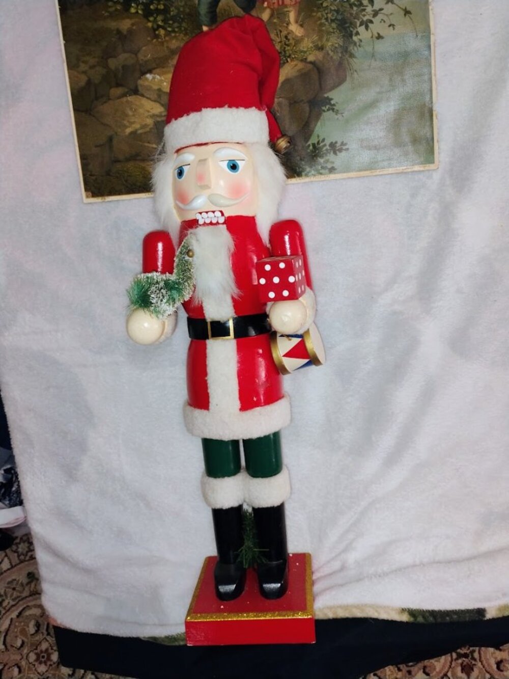 Santa Claus nutcracker stands approximately 24 inches tall